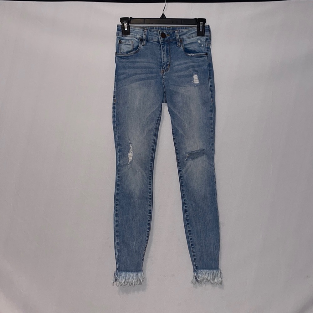 Distressed/fringe skinny jeans